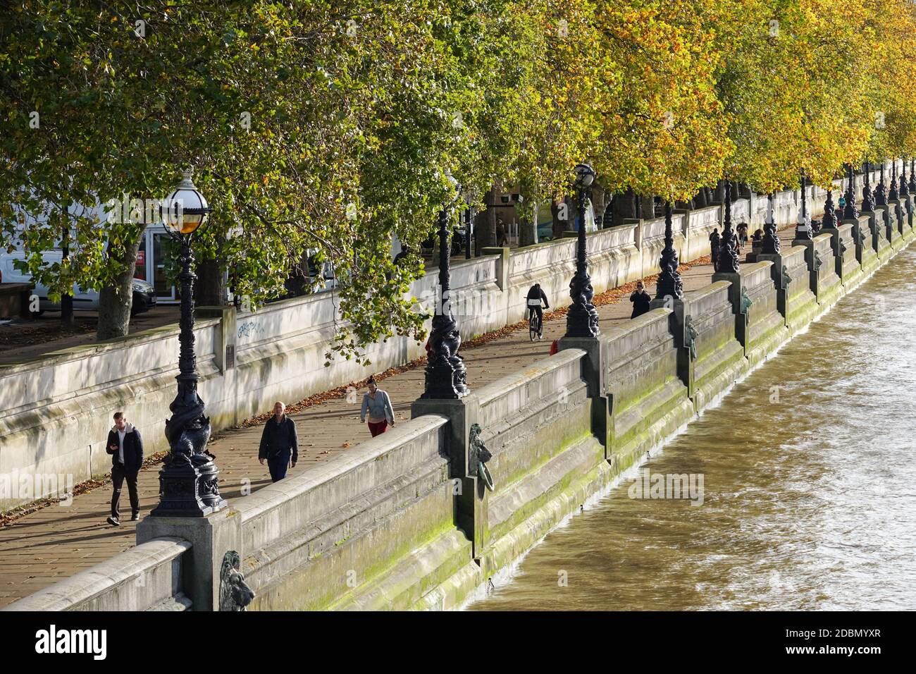 People walking on the Albert Embankment path, London England United Kingdom UK Stock Photo