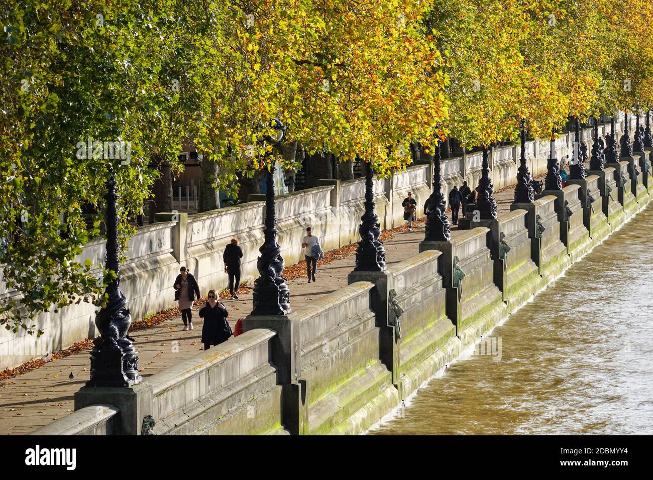People walking on the Albert Embankment path, London England United Kingdom UK Stock Photo
