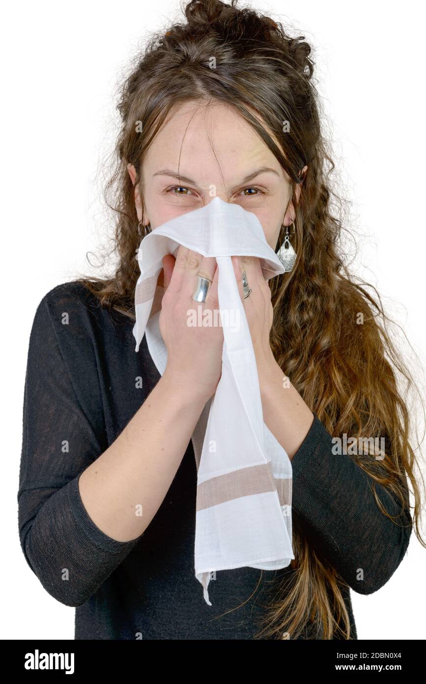 a young woman has a cold on the white background Stock Photo