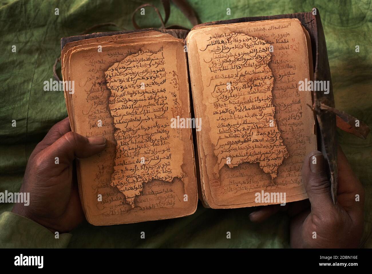 Bularaf holding a Islamic Medical Manuscript  from 16th century. Stock Photo