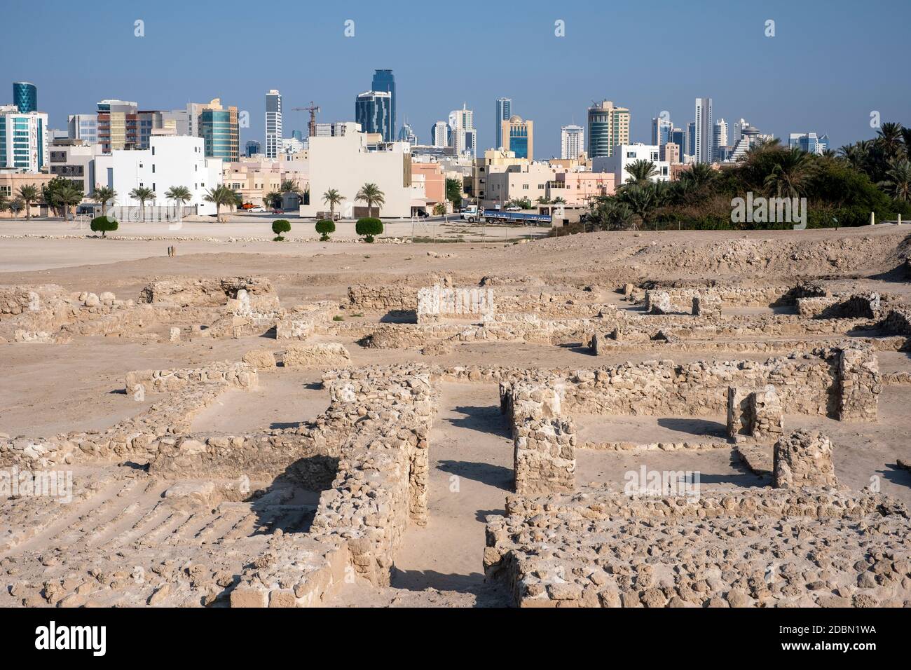 The modern city of Manama, Bahrain viewed from the ruins of the Bahrain fort Stock Photo