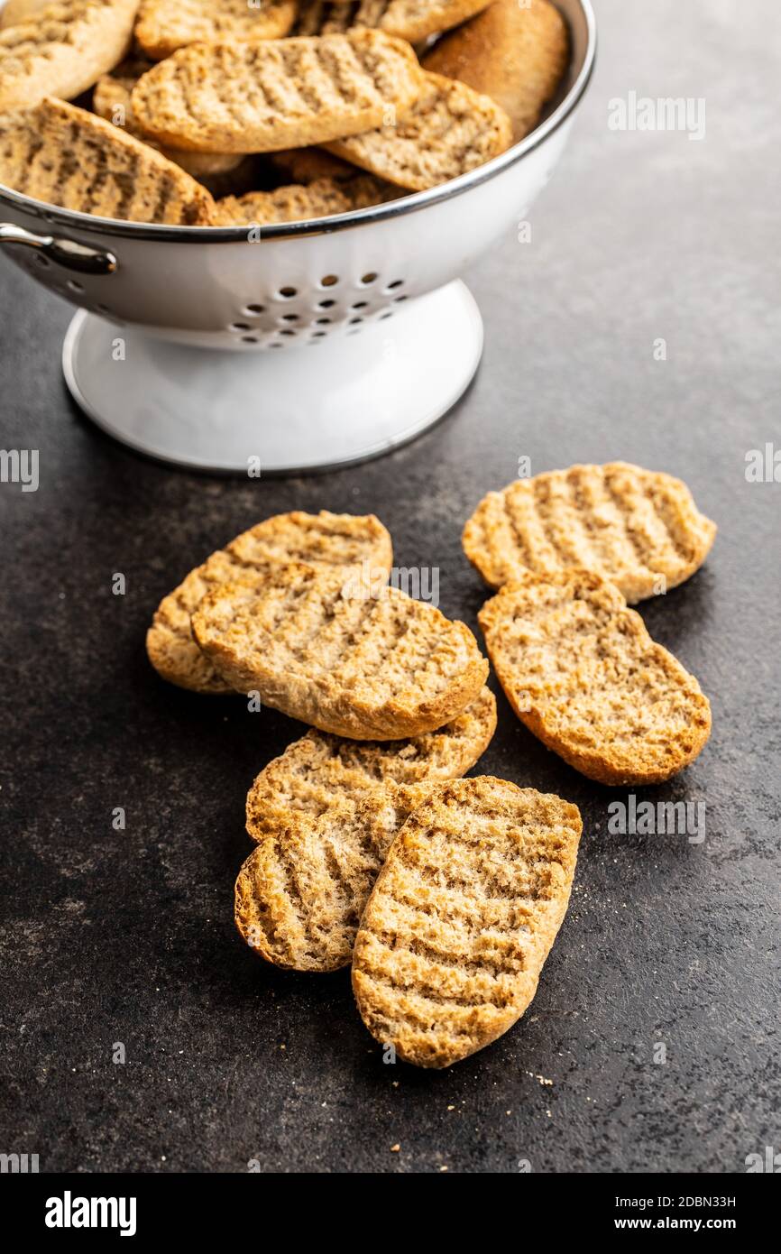 Rusk bread. Dried crispbread on kitchen table. Stock Photo