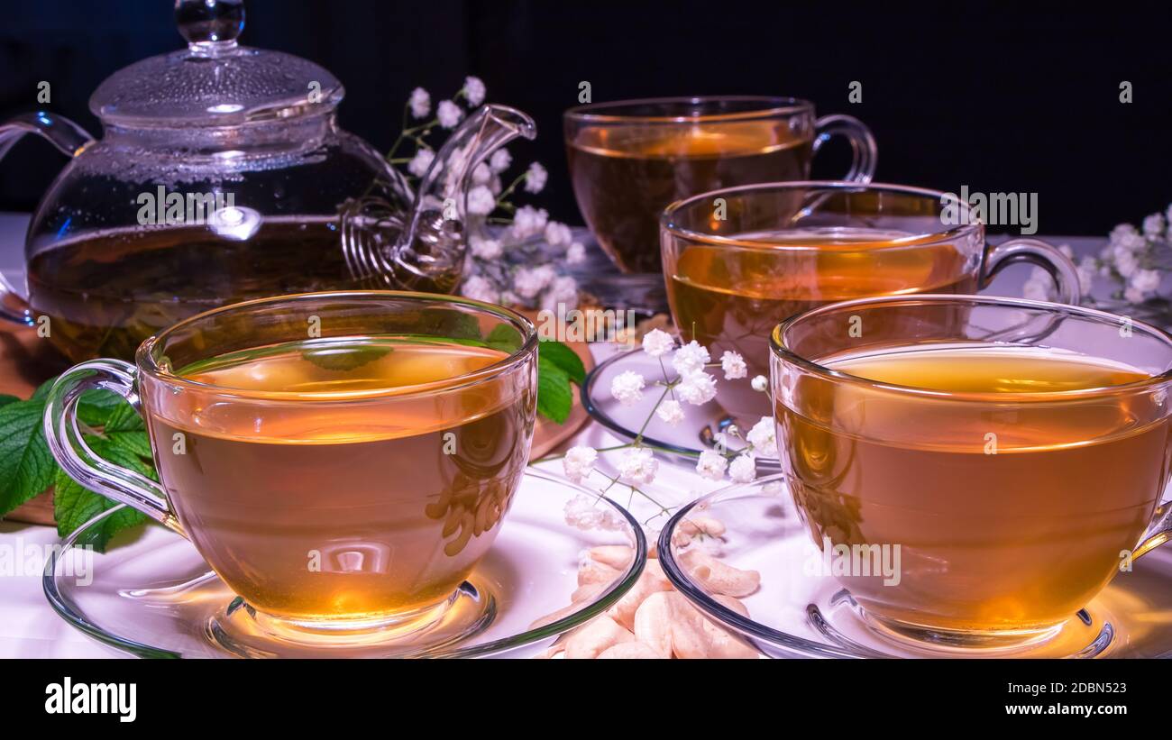 English tea. Red hot hibiscus tea in glass mug. Tea time: cup of tea ...