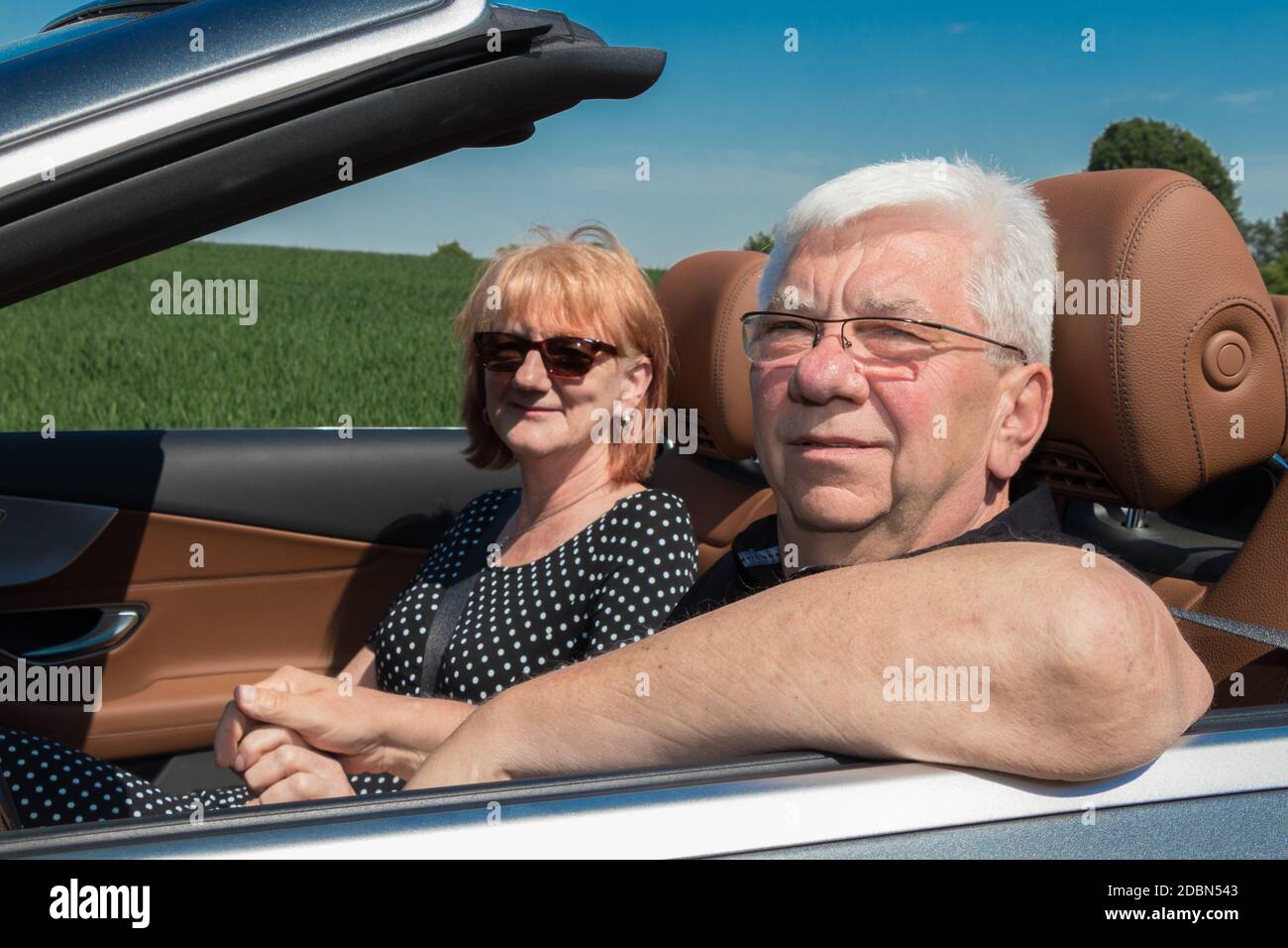 Smiling happy senior couple in the car Stock Photo