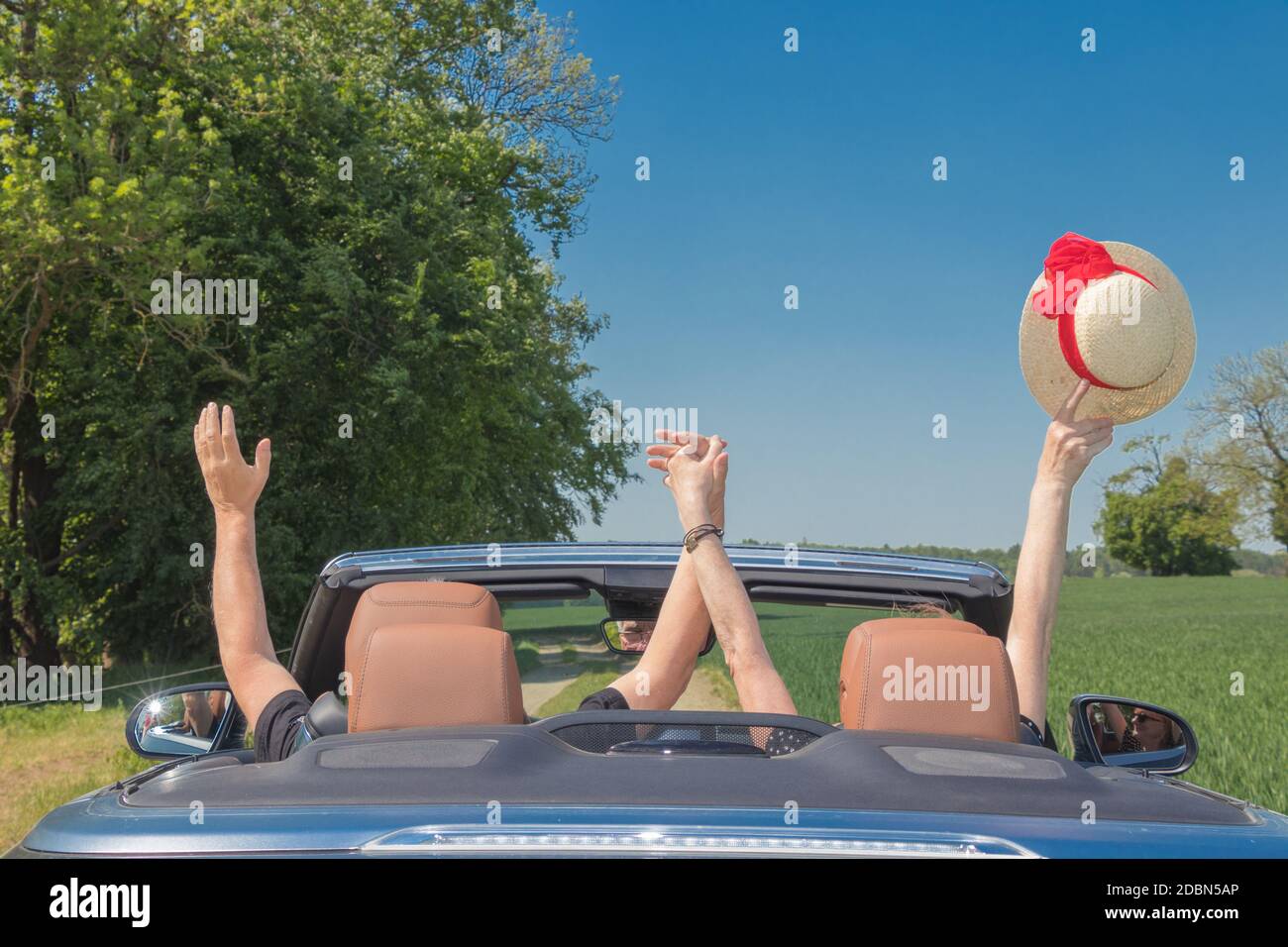 Happy senior couple in sports car Stock Photo