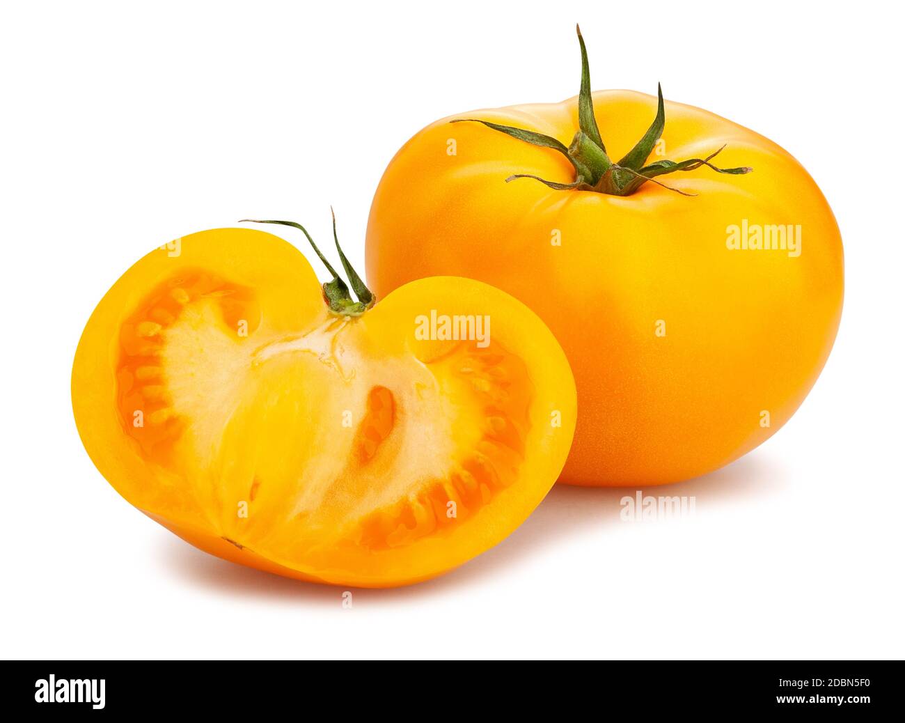 sliced yellow tomato path isolated on white Stock Photo