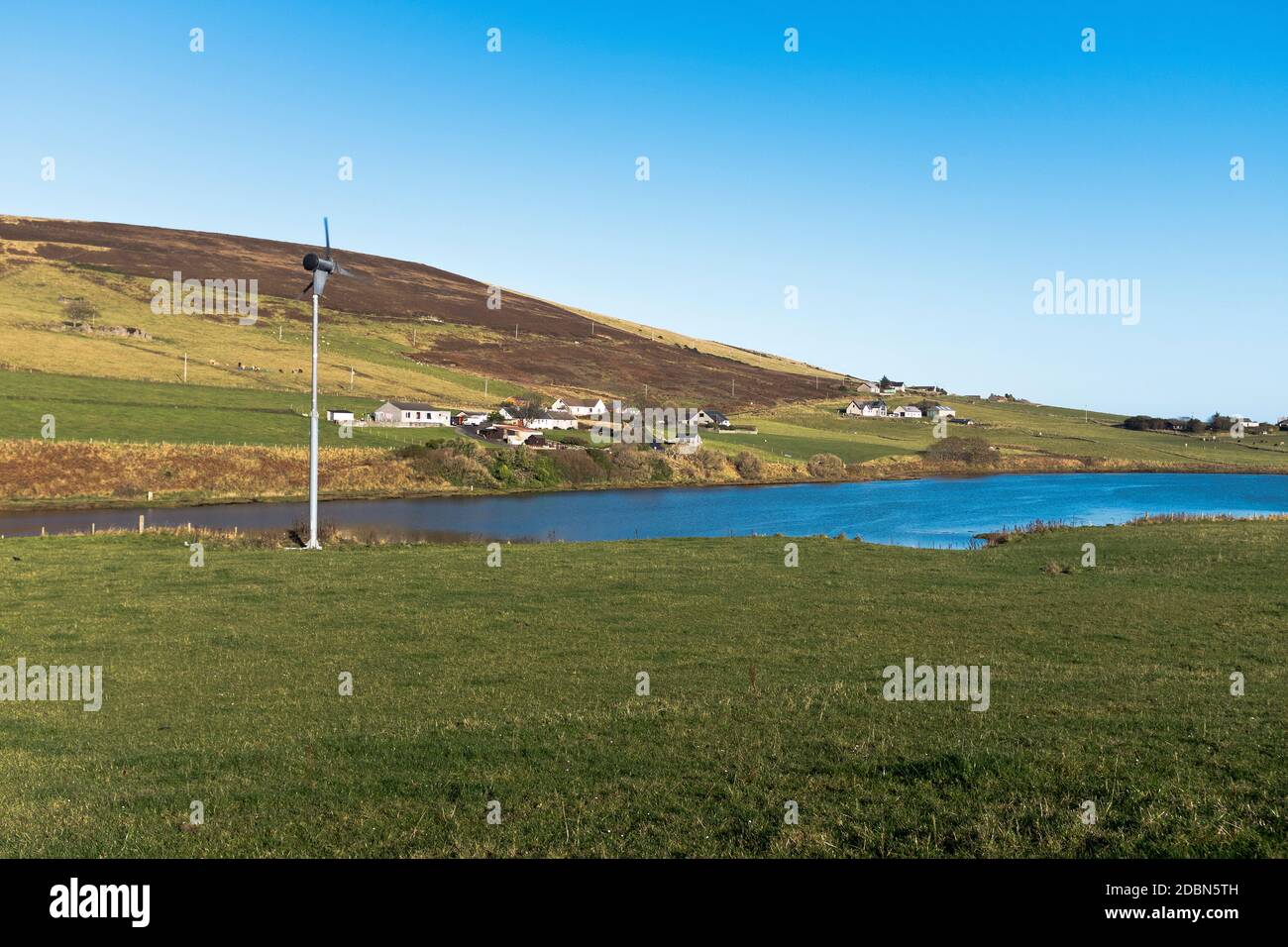 dh Finstown FIRTH ORKNEY Scottish isles rural houses small wind turbine house uk power scotland windturbine energy Stock Photo