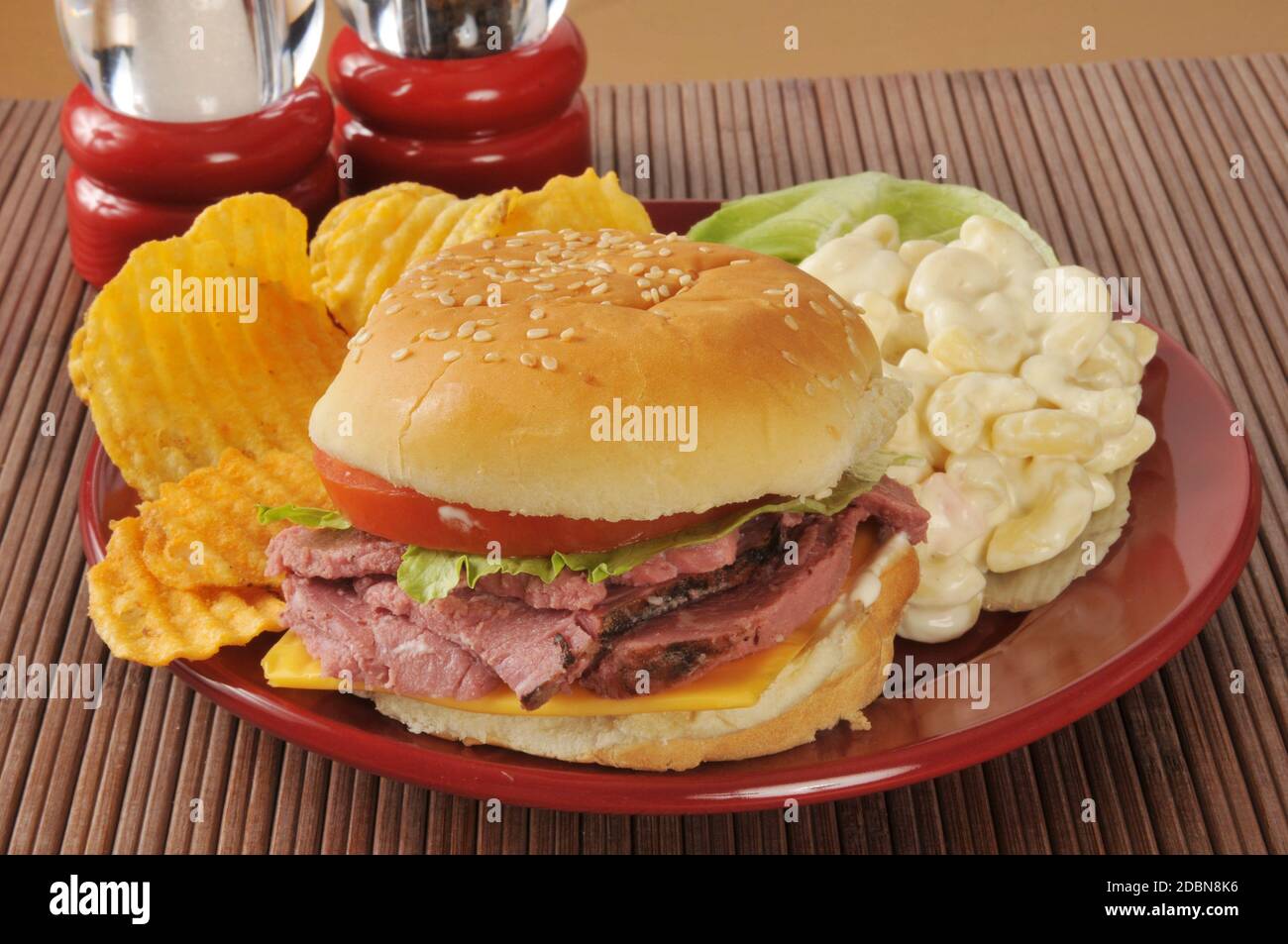 Roast beef sandwich on a hamburger bun with macaroni salad Stock Photo Alamy