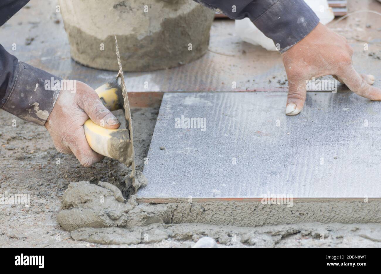 Mason was repaired for the floor tile Stock Photo