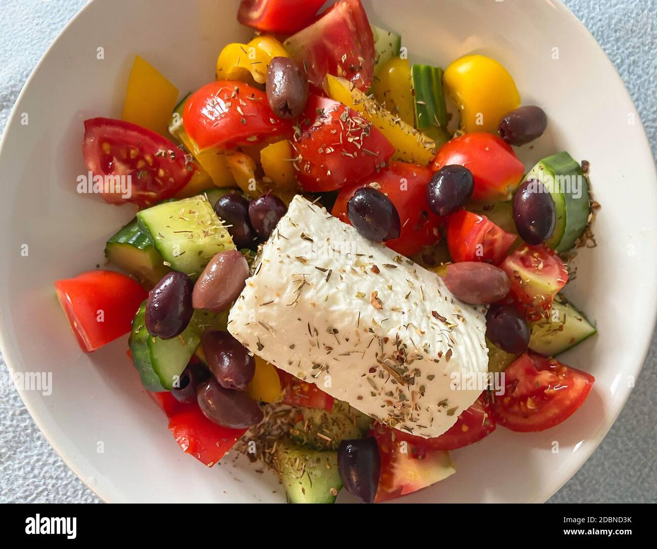 Greek salad on table in small taverna, Old Corfu Town, Kerkyra, Corfu, Ionian Islands, Greece Stock Photo