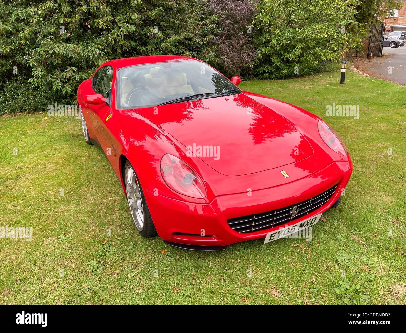 Red Ferrari sports car on lawn, Maidenhead, Berkshire, England, United Kingdom Stock Photo