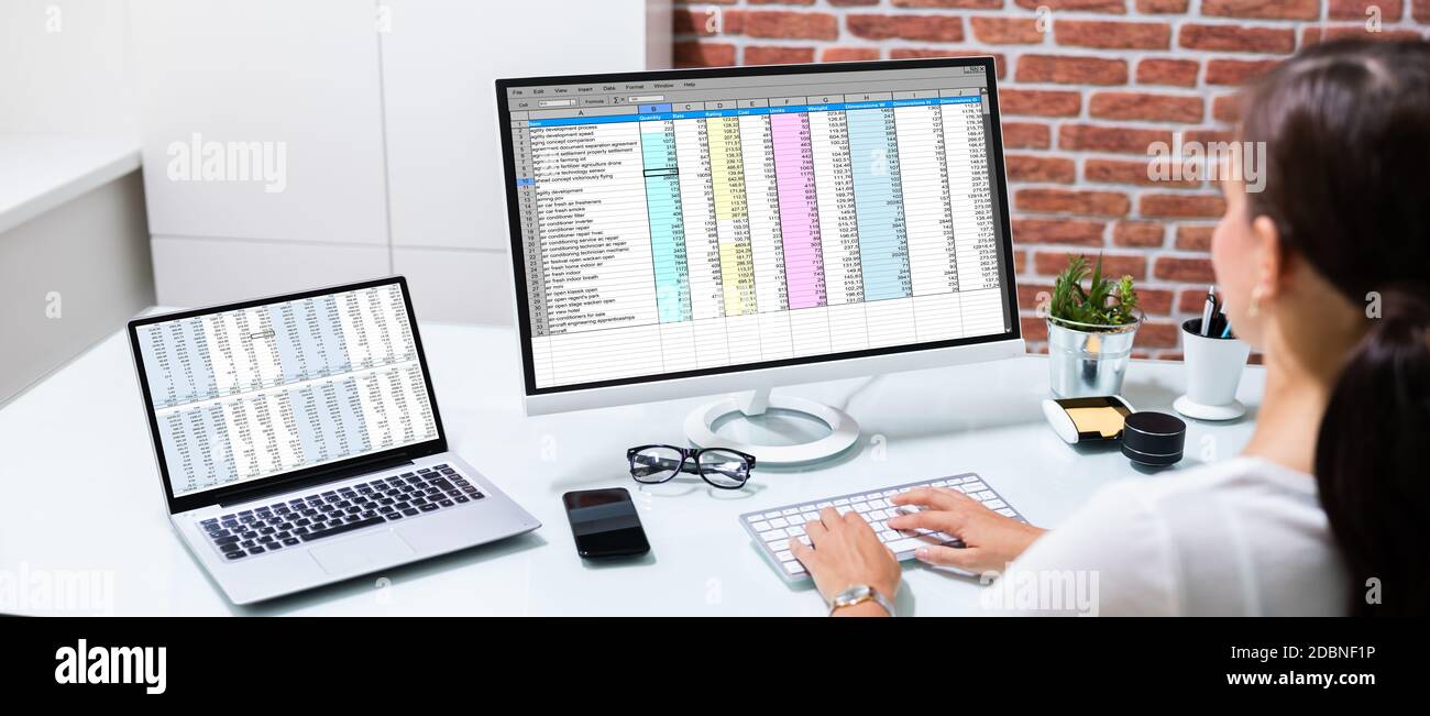 Working With Spreadsheet. Analyzing Data On Laptop Screen Stock Photo