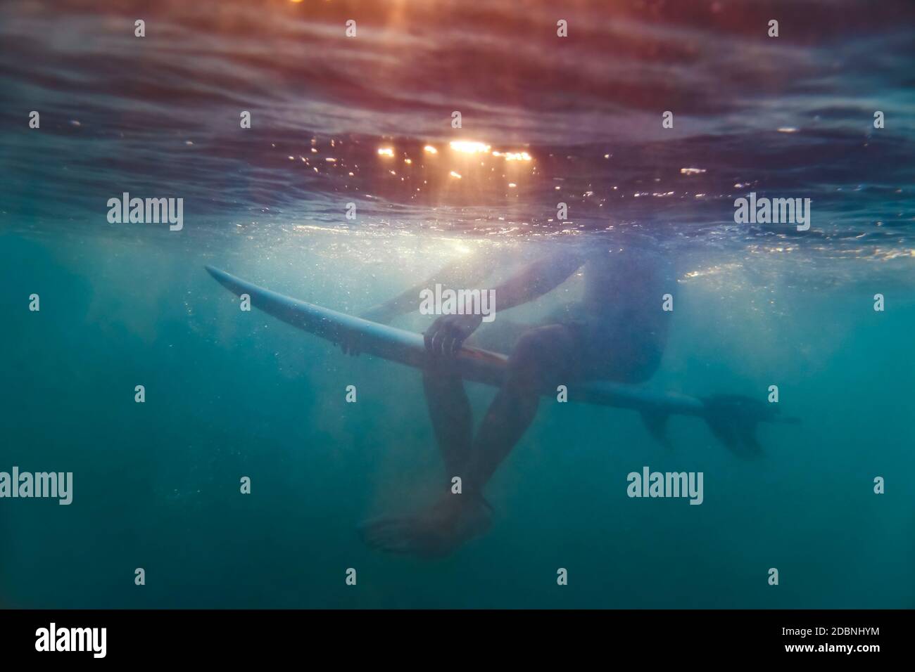 Surfer sitting on surfboard,Lombok,Indonesia Stock Photo Alamy