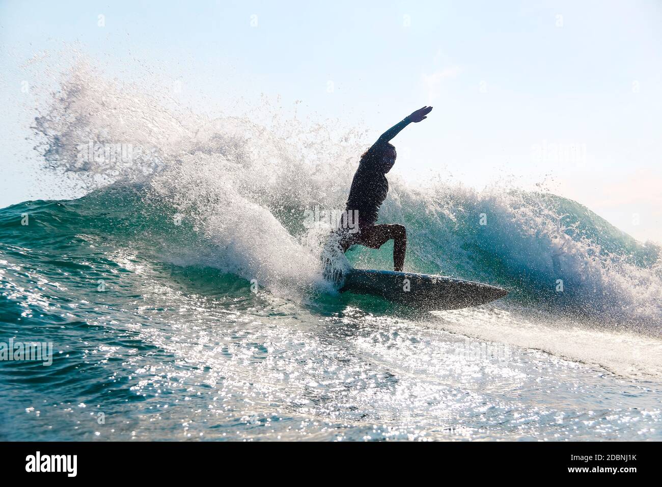 Surfer on a wave,Lombok,Indonesia Stock Photo