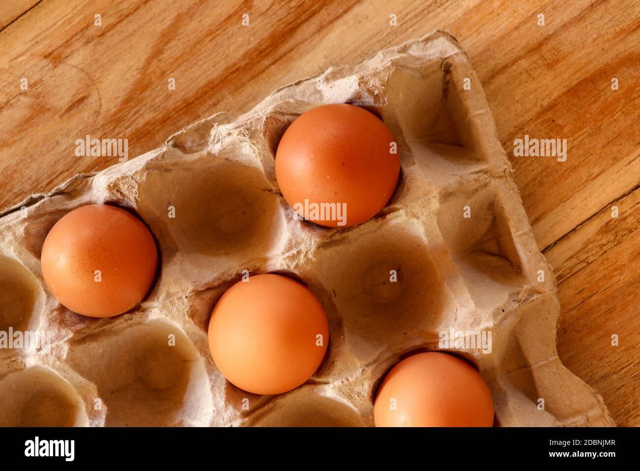 Thirty brown chicken eggs in a cardboard tray packaging. Raw fresh hen eggs in a carton box. Egg pattern background for easter, breakfast, cuisine. To Stock Photo