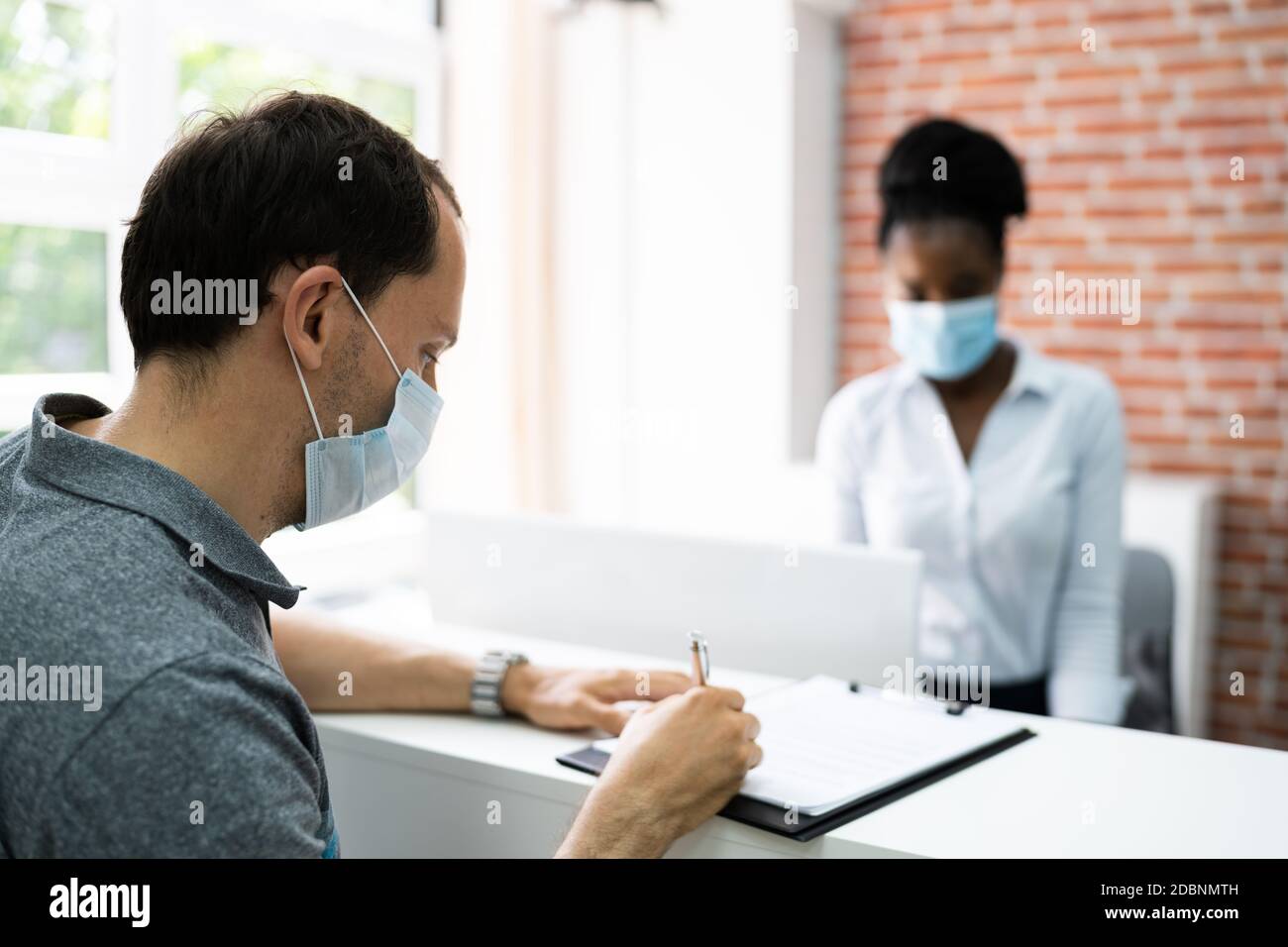 Hotel Desk Reception Covid19 Medical Mask Protection Stock Photo Alamy