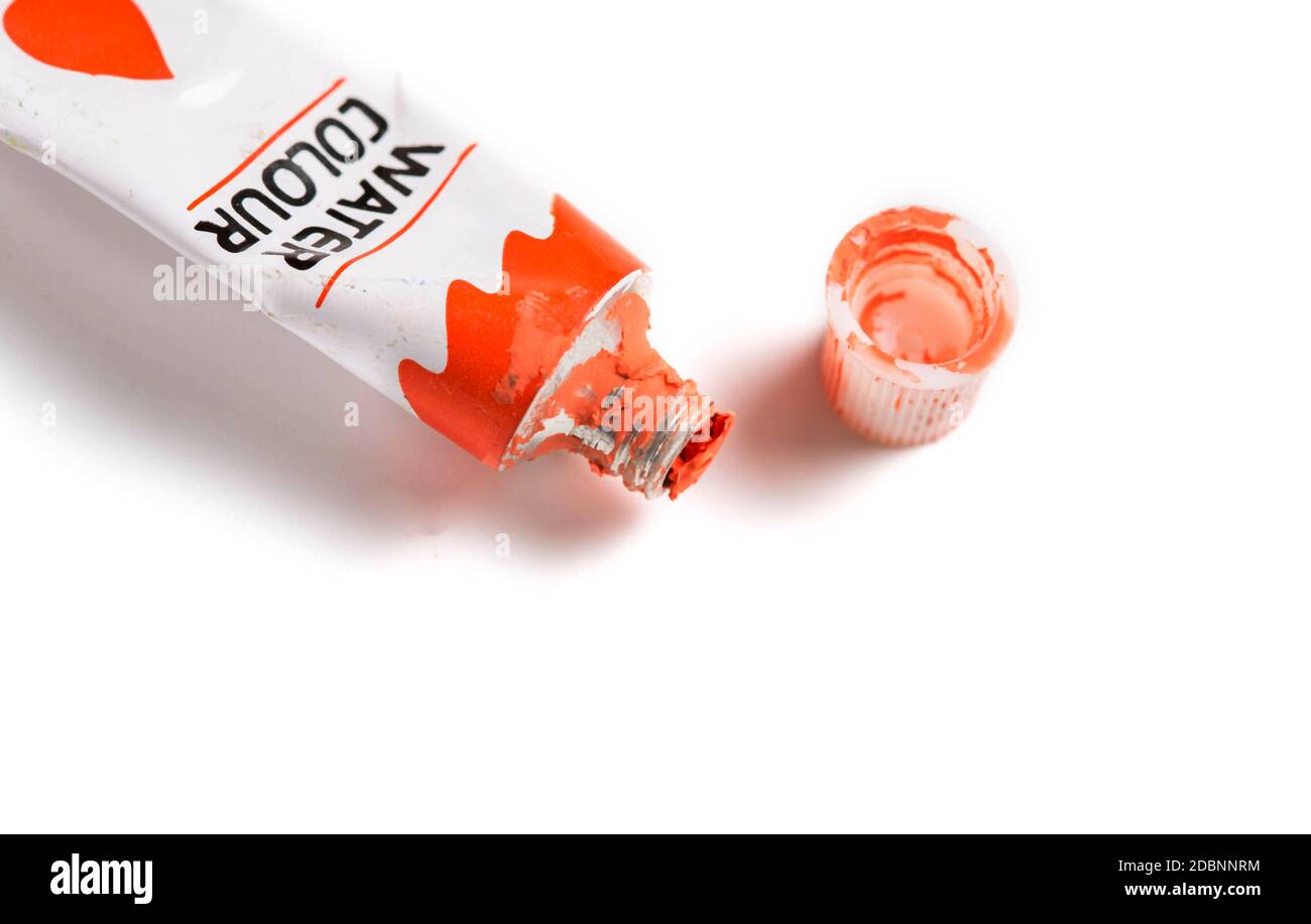 Dried red watercolor paint in a tube isolated on white background Stock