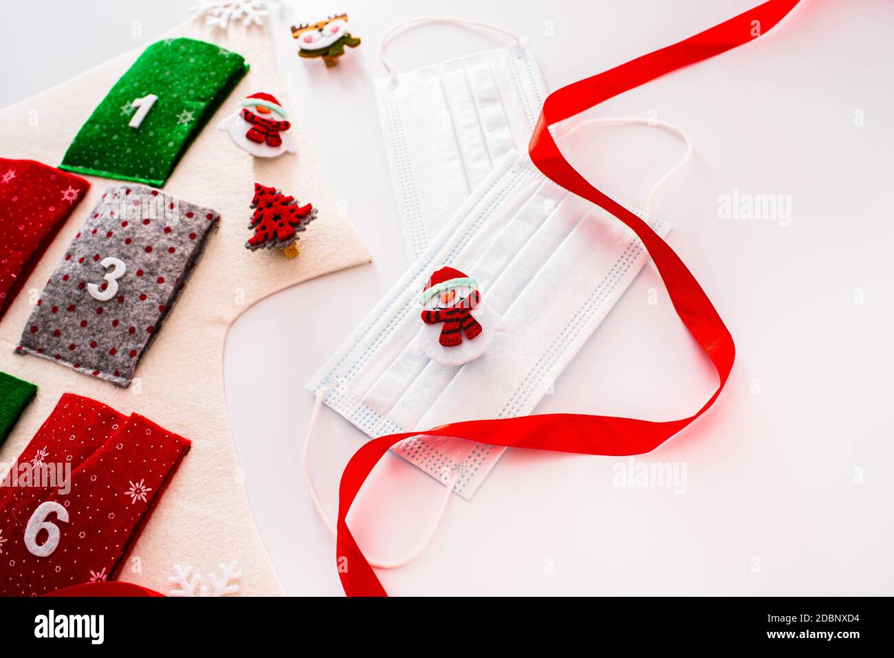 Traditional advent calendar protected with medical face masks, isolated on  white background Stock Photo - Alamy