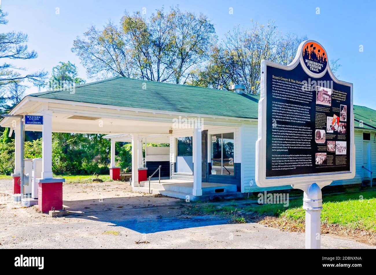 A historic plaque for Emmitt Till stands alongside Bryant’s Grocery (not pictured) and Ben Roy’s Service Station in Greenwood, Missississippi. Stock Photo