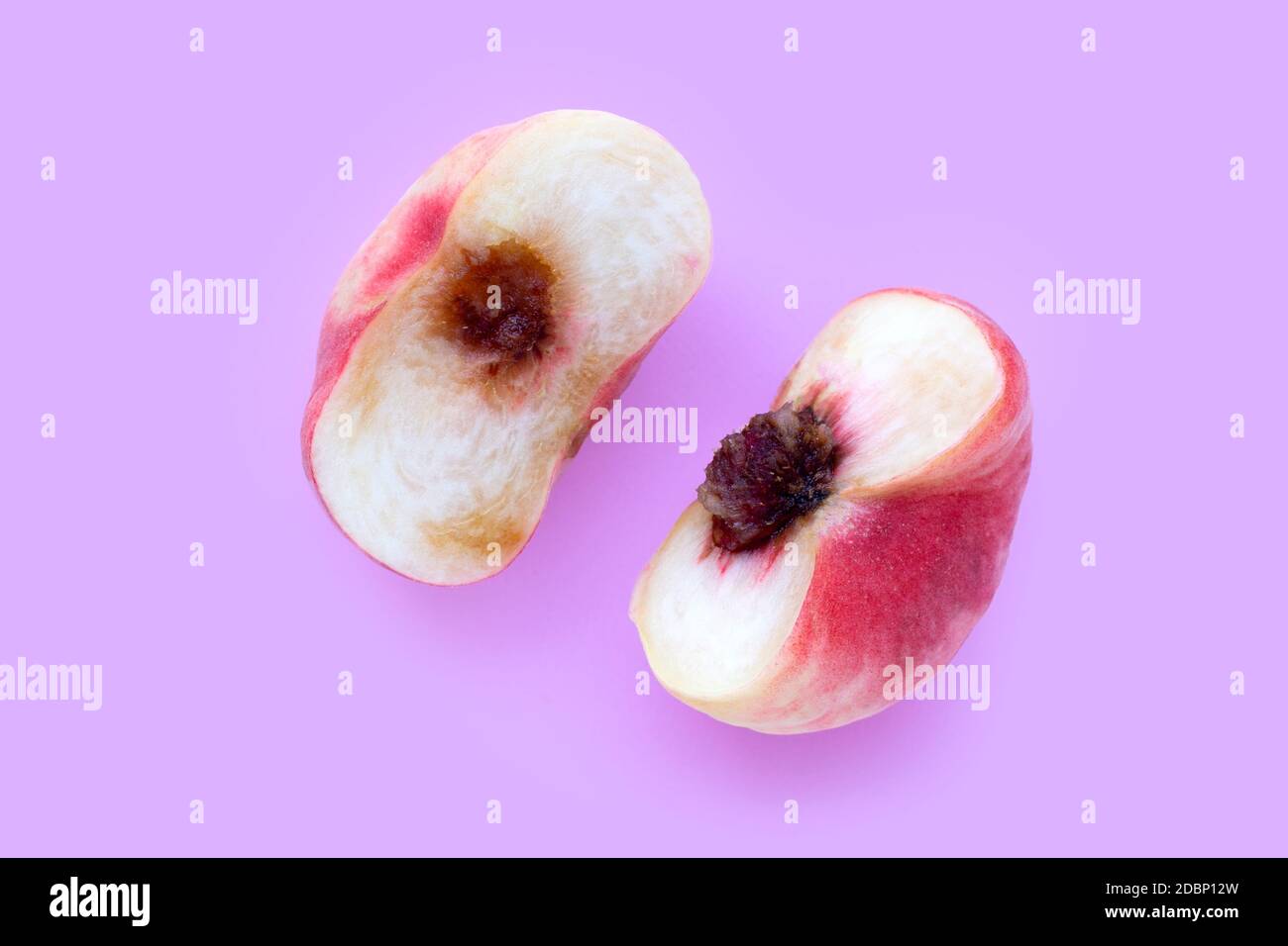 Chinese flat peaches on pink background. Top view Stock Photo