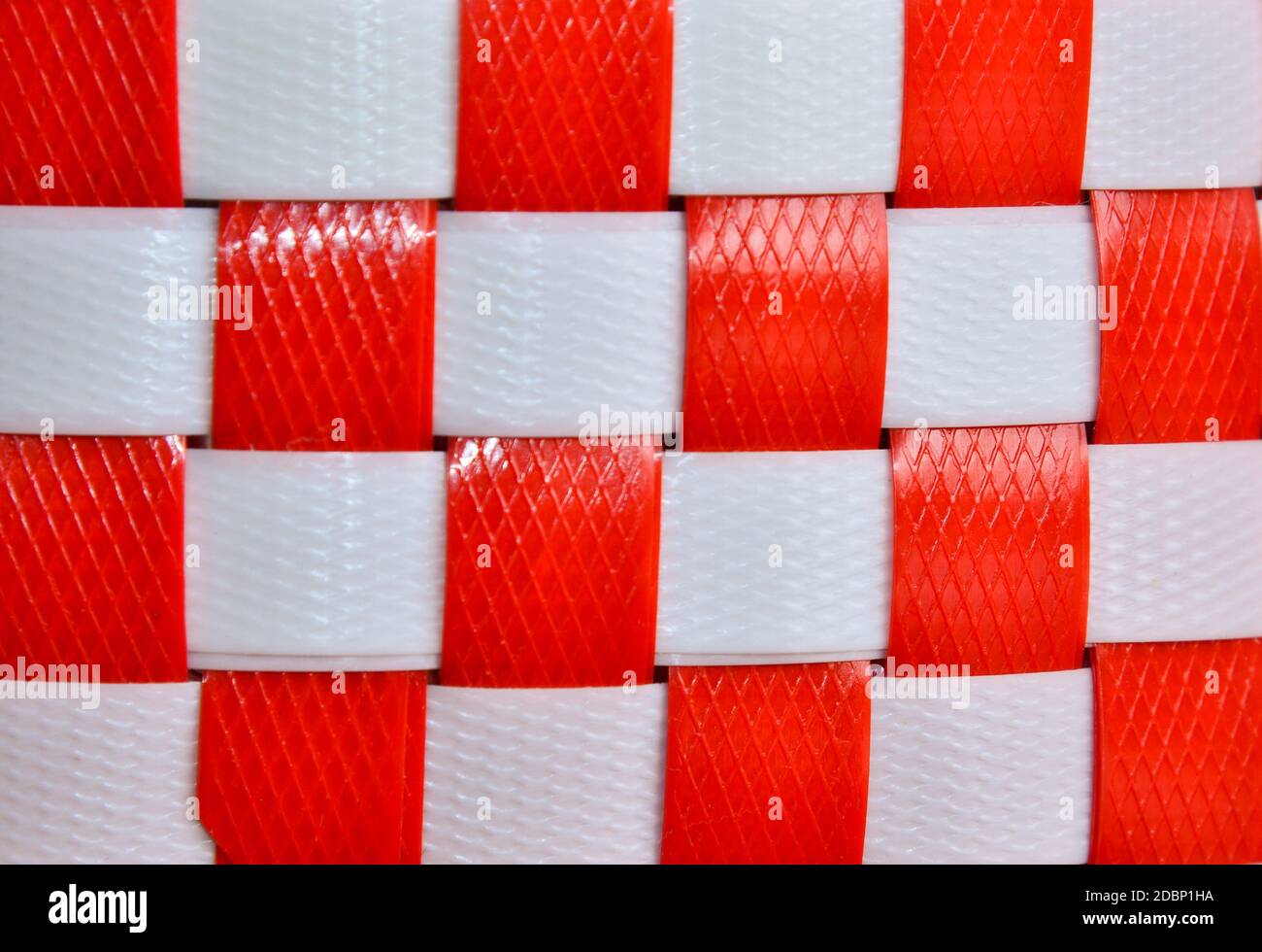 Dark Red and White Checkers textured plastic rope background Stock Photo