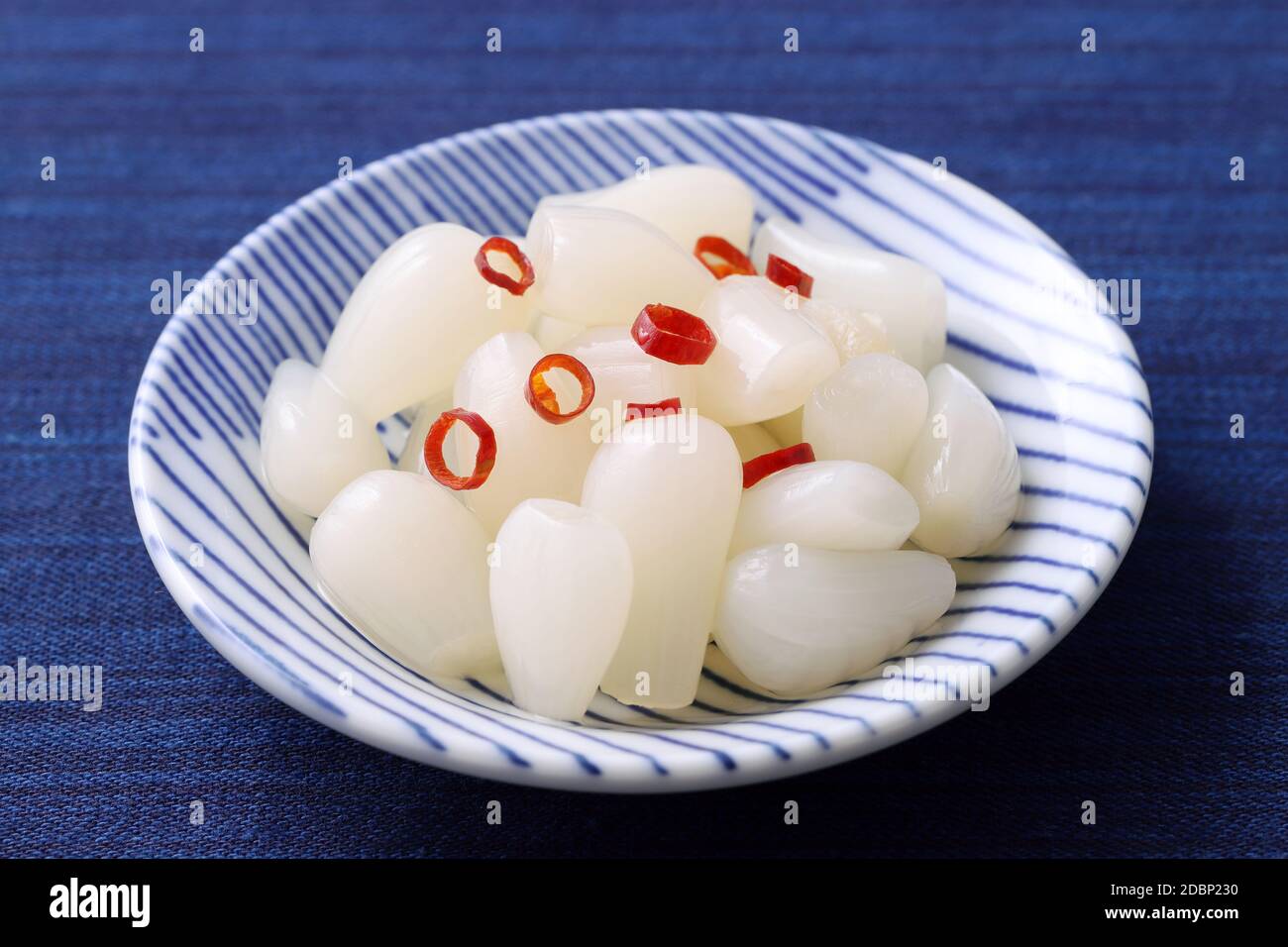 Japanese Rakkyo, Sweet and sour pickled scallions in a dish Stock Photo