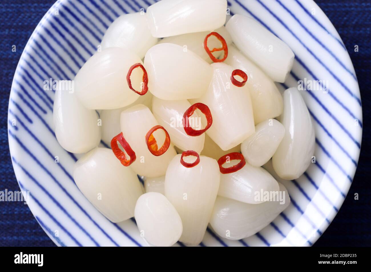Japanese Rakkyo, Sweet and sour pickled scallions in a dish Stock Photo