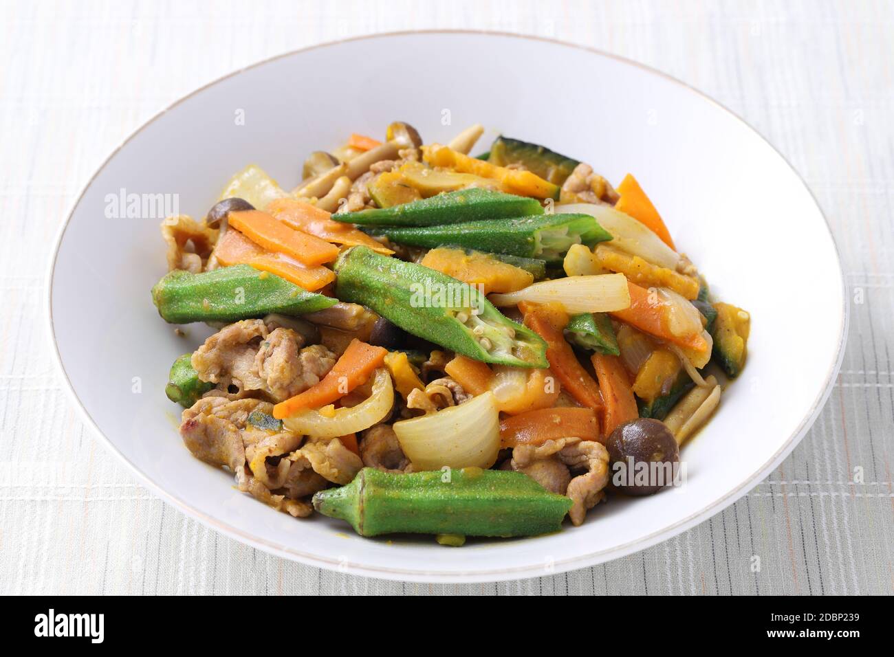 Vegetable stir fry in a plate on white background. Close up Stock Photo