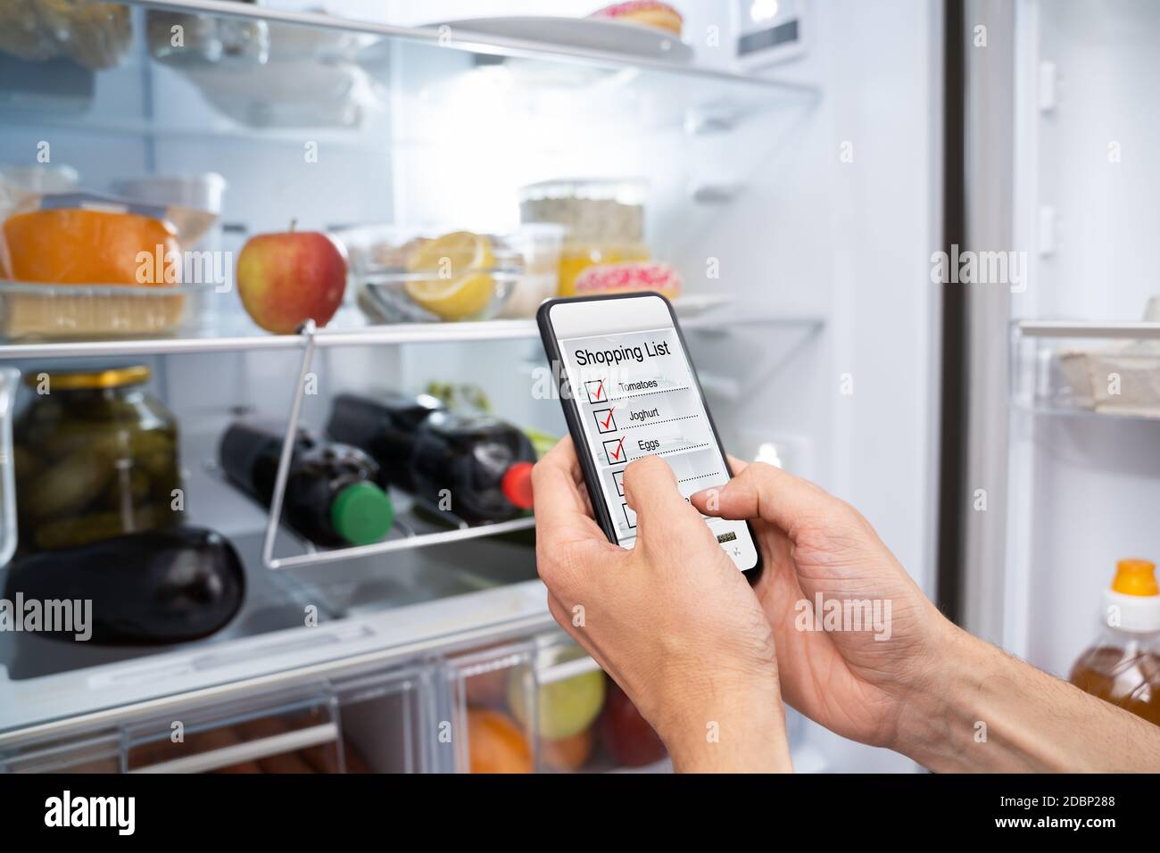 Consumer Grocery Shopping List App And Fridge Stock Photo Alamy