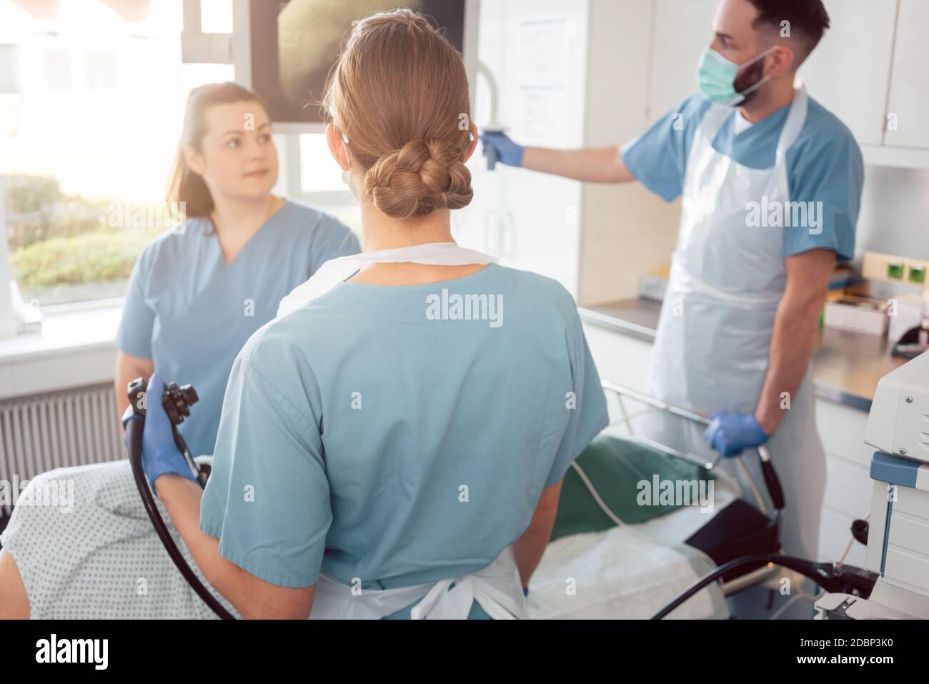 doctors in internal department of hospital performing endoscopy in