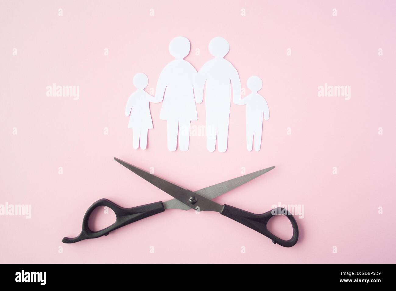 black scissor cutting family paper cut , dysfunctional family, bad children development, divorce parent broken family concept, mental health Stock Photo