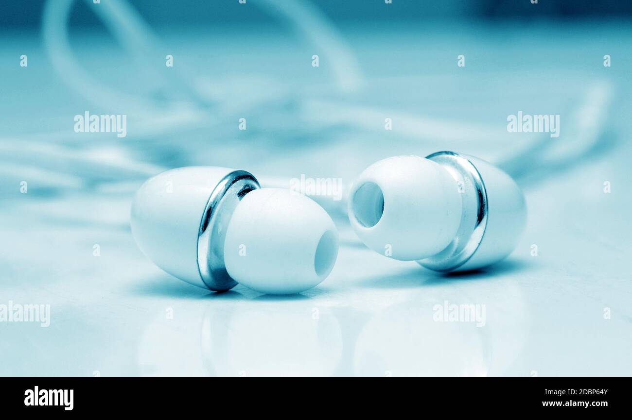 earphones buds macro closeup on table Stock Photo