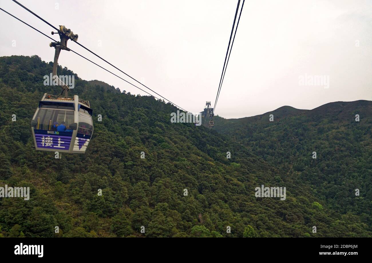 Hong Kong - Big Buddha Cable Cars going over the hills Stock Photo - Alamy