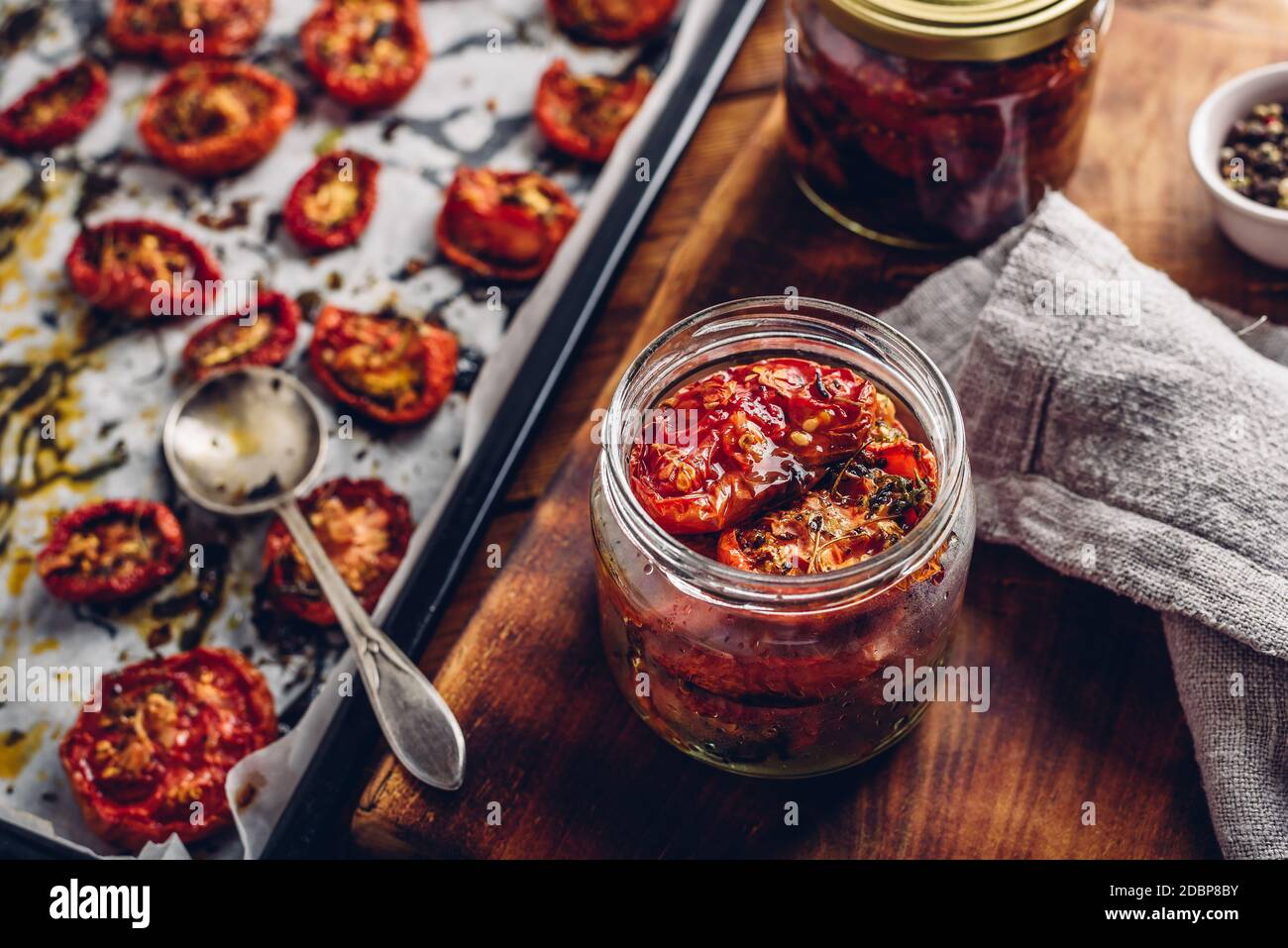 Preserving of Sun Dried Tomatoes with Herbs in a Jar Stock Photo Alamy