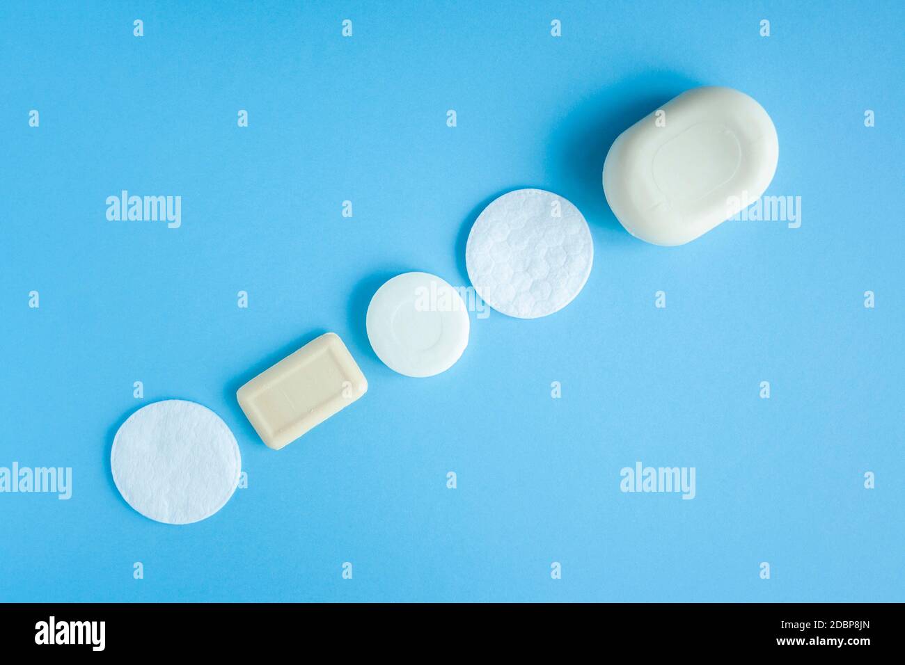 Composition of soap and cotton pads top view. Self hygiene against bacteria and viruses. Compliance with hygiene and sterility to combat coronavirus. Stock Photo