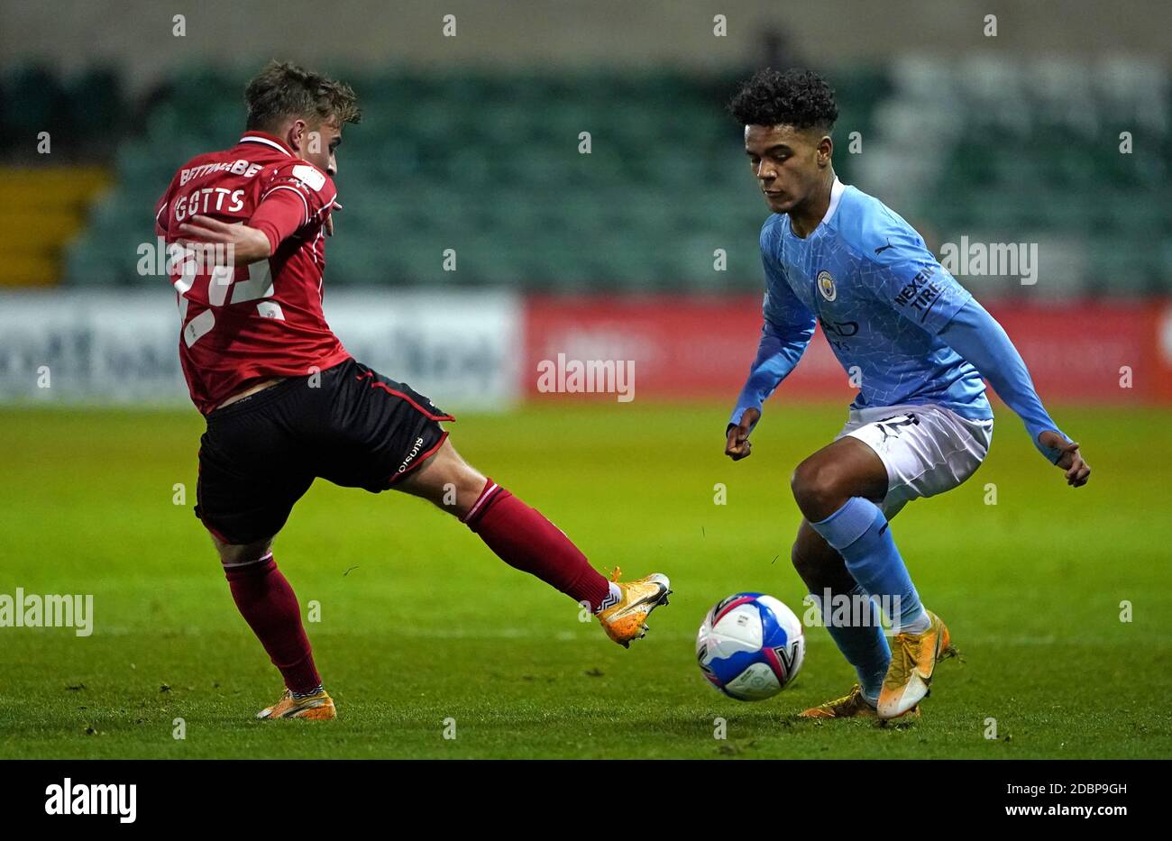 Lincoln City’s Robbie Gotts (left) and Manchester City's Oscar Robb ...