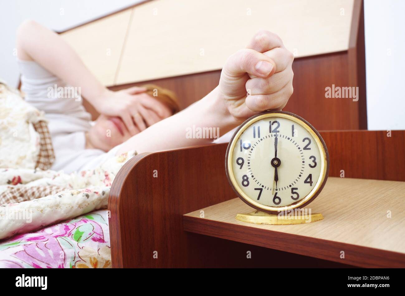 woman and alarm clock in the bedroom Stock Photo Alamy