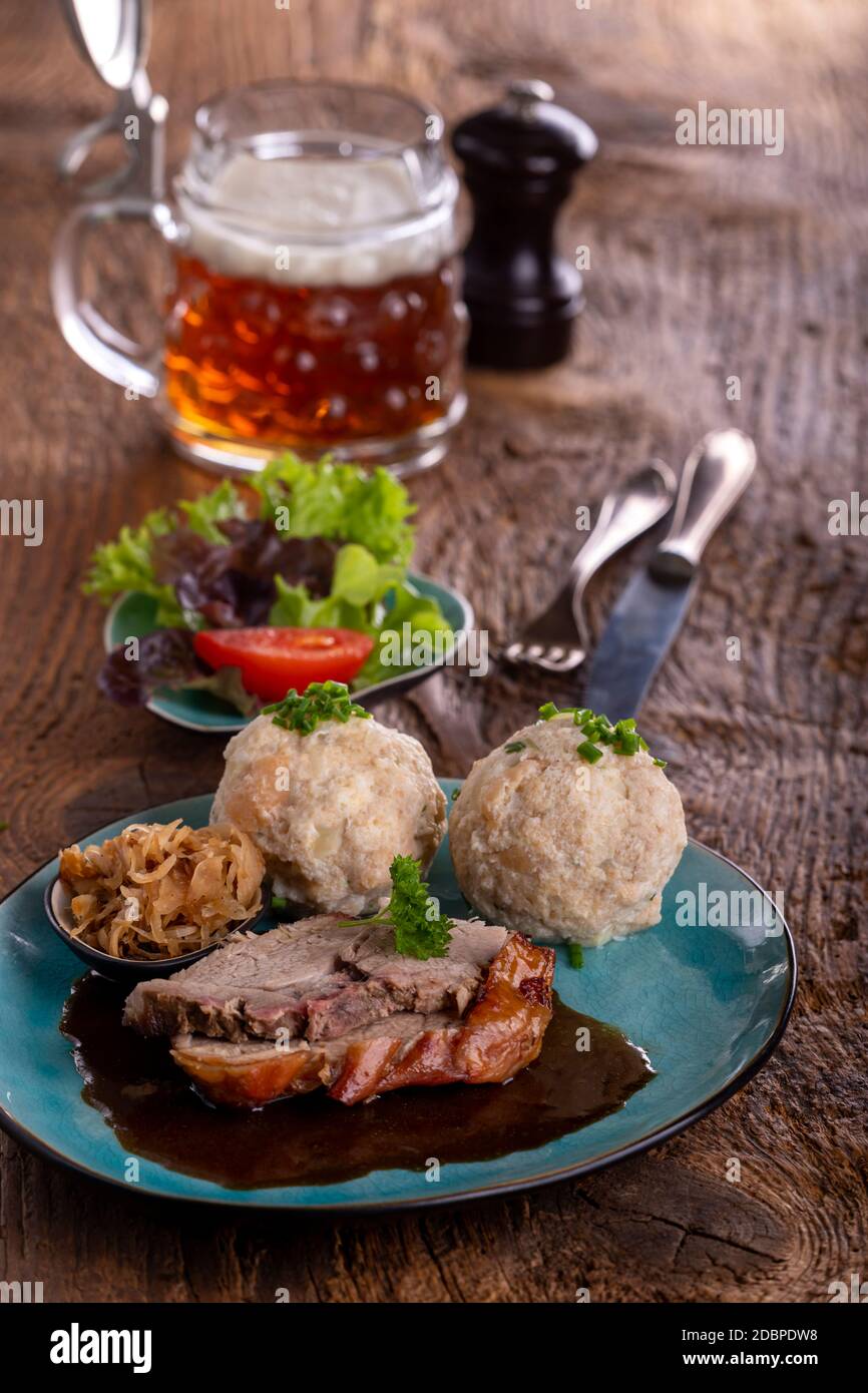bavarian roast pork with dumplings Stock Photo Alamy