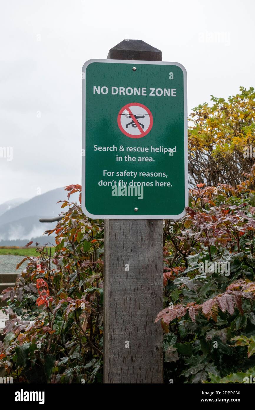 A sign that indicates a no drone fly zone due to search and rescue helipad Stock Photo