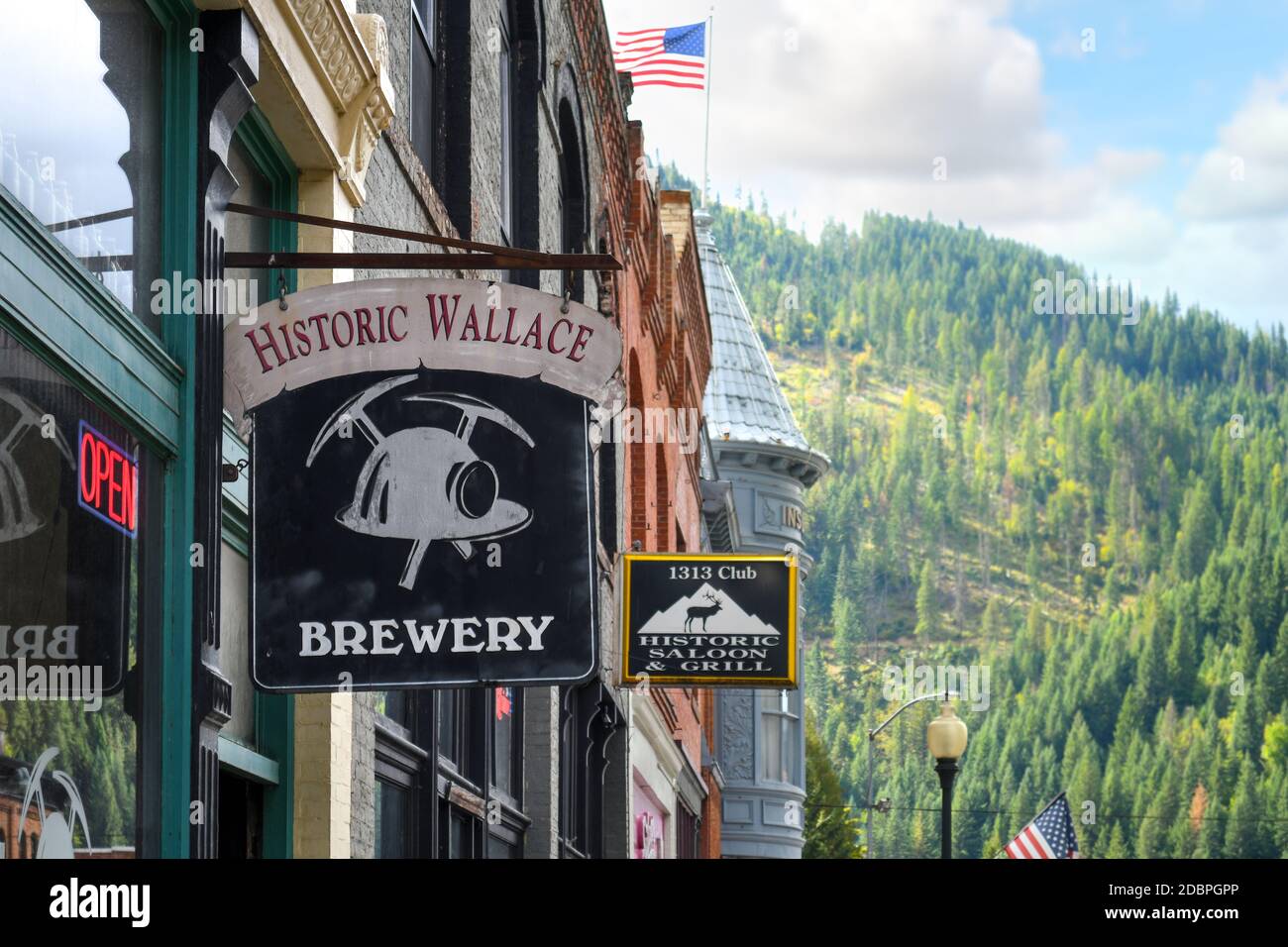 A sign hangs outside a business in the historic district of the mining