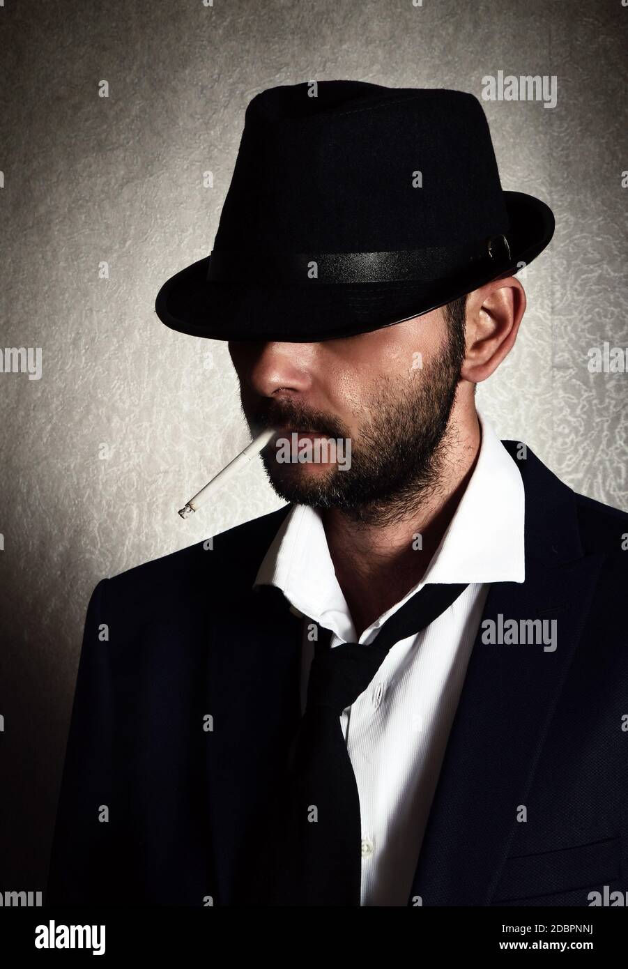 Retro man with the hat and cigarette Stock Photo - Alamy