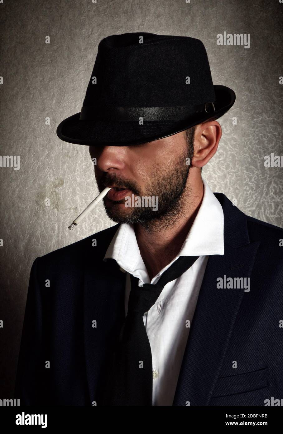 Retro man with the hat and cigarette Stock Photo