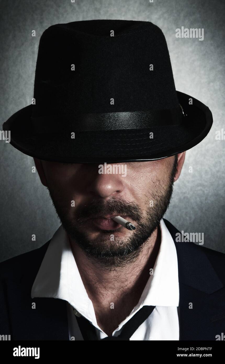 Retro man with the hat and cigarette Stock Photo