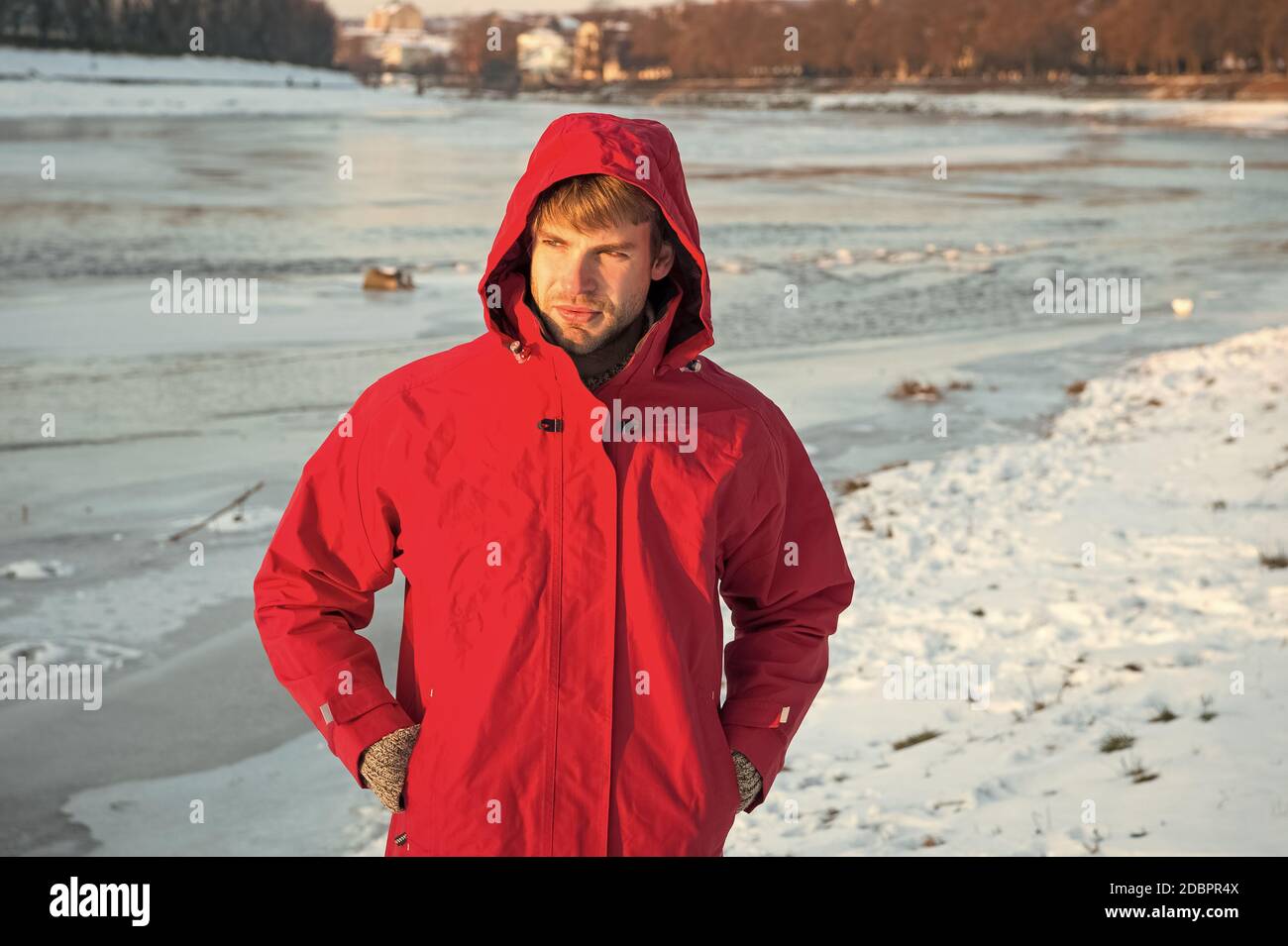 Polar explorer. Sunny winter day. Winter menswear. Winter outfit.  Comfortable outfit. Guy jacket hood. Man warm jacket snowy nature  background. Wind resistant clothes. Winter fishing. Safety measures Stock  Photo - Alamy