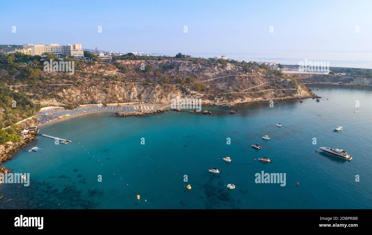 Aerial bird's eye view of Konnos beach in Cavo Greco Protaras, Paralimni, Famagusta, Cyprus. The famous tourist attraction golden sandy Konos bay with Stock Photo