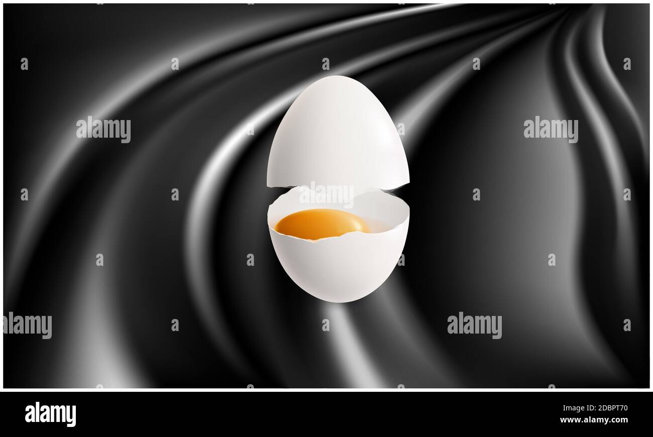 broken egg with yellow yolk on abstract black surface Stock Photo