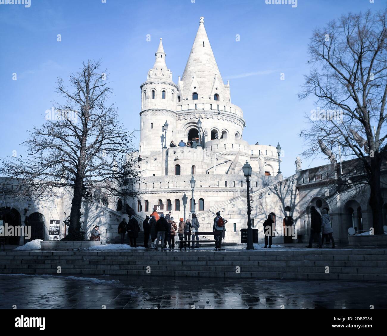 Tourism at Fisherman's Bastion (hungarian: Halászbástya) on a snowy winter day in Budapest, capital of Hungary. Stock Photo