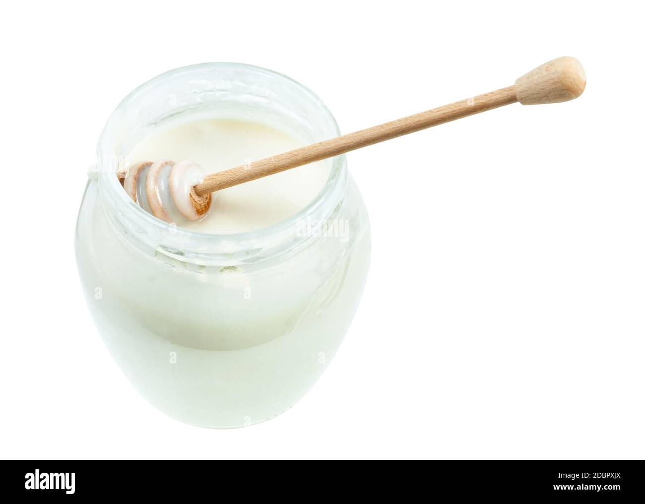 above view of wooden stick in glass jar with natural organic white honey isolated on white background Stock Photo