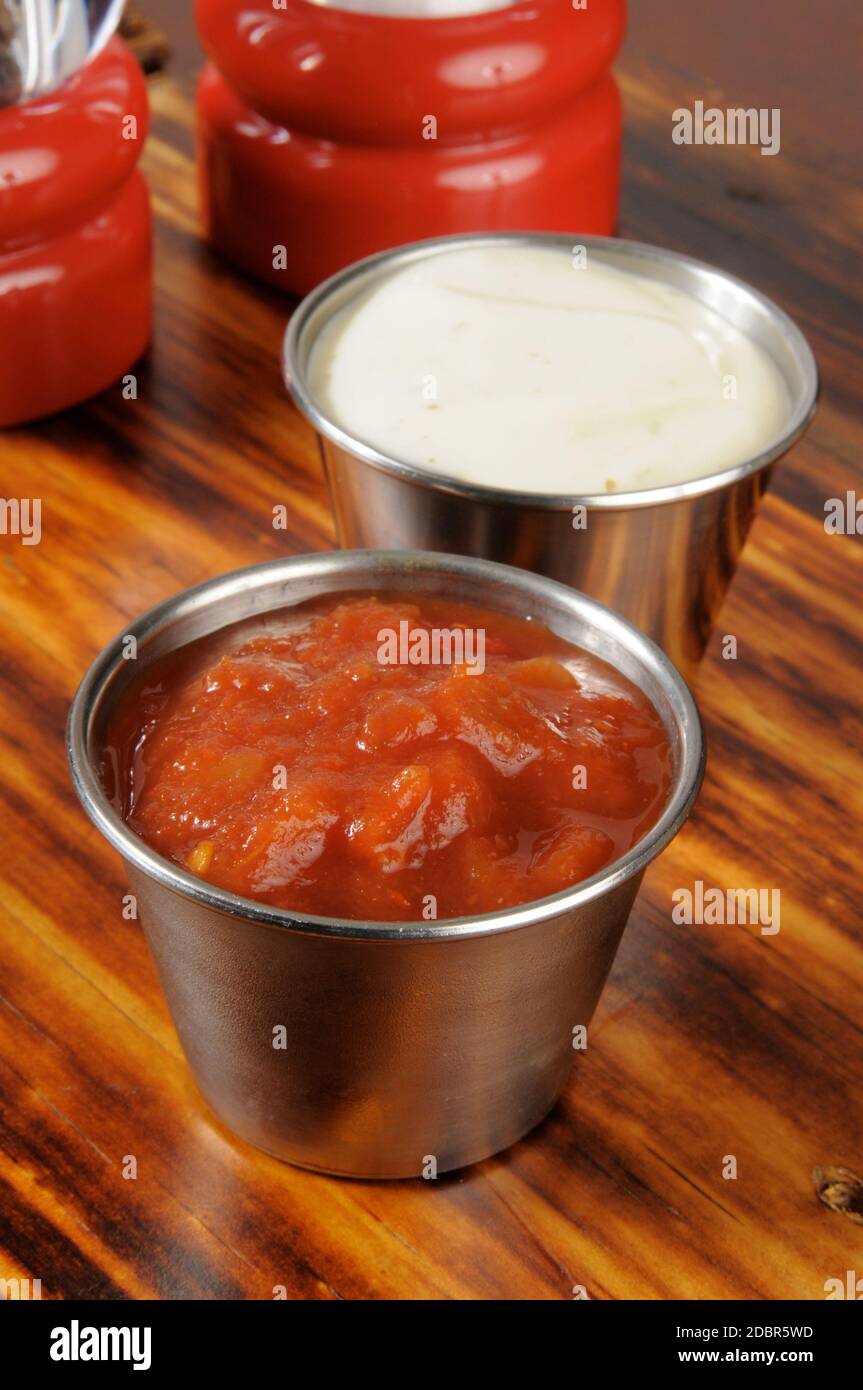 Tin cups of salsa and ranch dressing dips for snacks Stock Photo Alamy