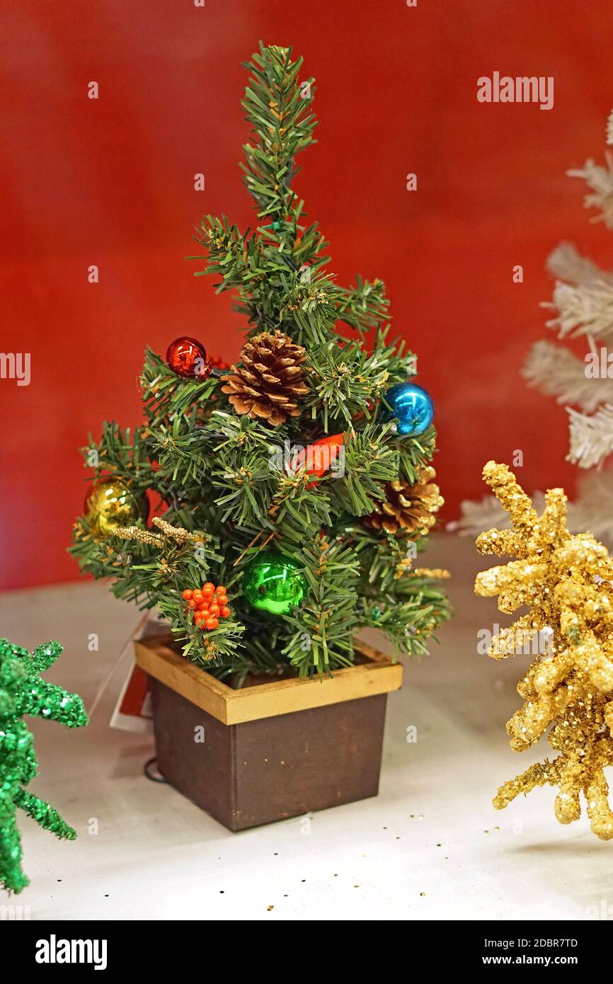 Miniature desktop Christmas tree in pot festive Stock Photo Alamy